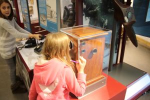 lois looking at the display in the museum