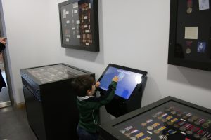 interactive screen surrounded by military medals