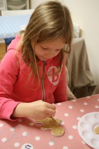 Girl painting her ornament
