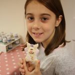 Girl holding her reindeer ornament