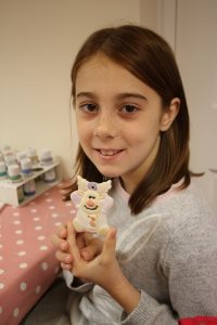 Girl holding her reindeer ornament