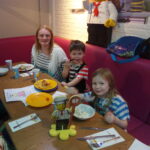 katie and kids eating in the Bricks restaurant