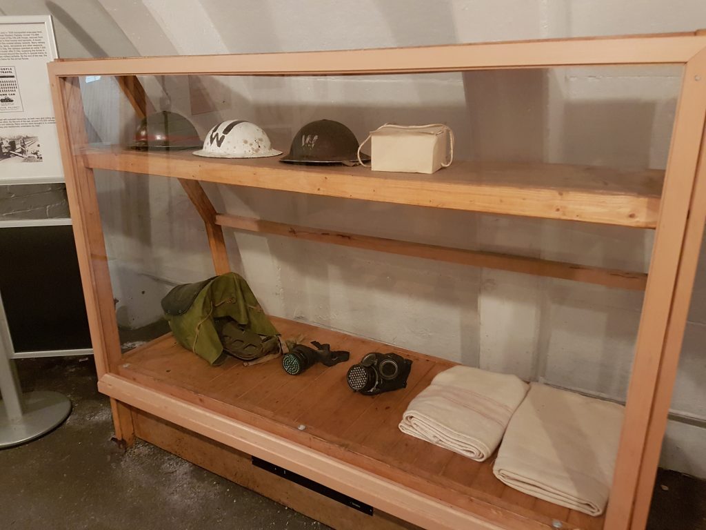 display box in air raid shelter with soldiers hats