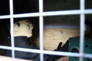 soldier manekin inside the chicken coop