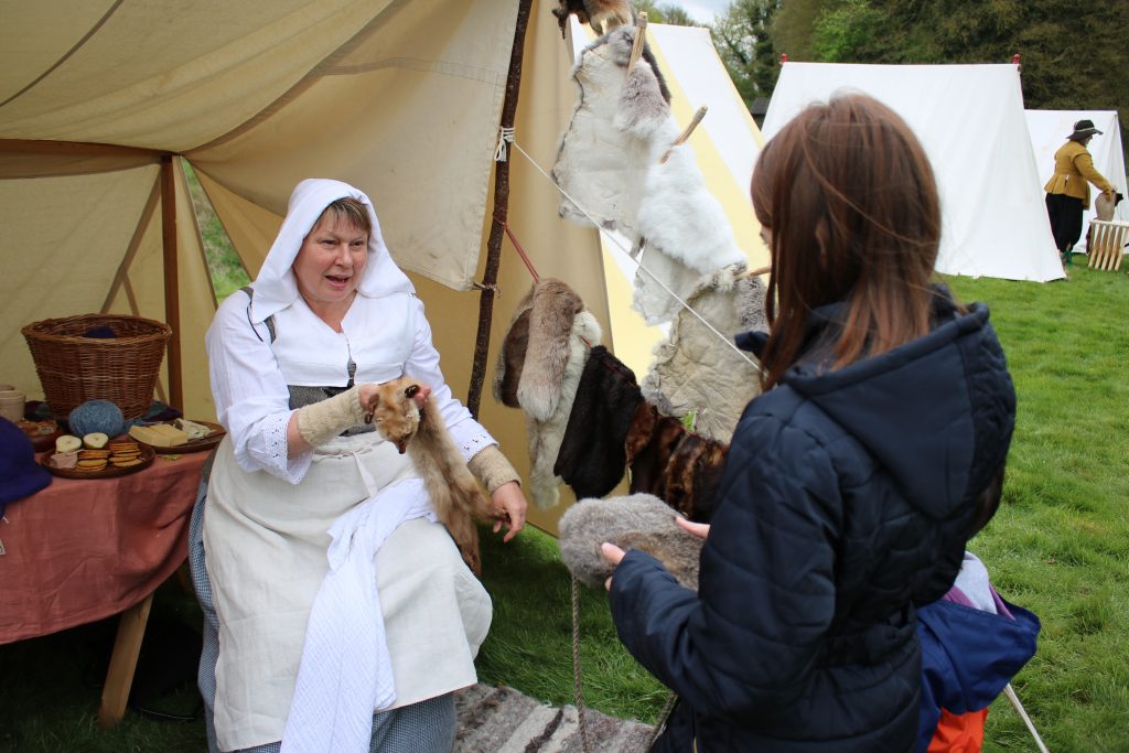 re-enactor with animal fur coats