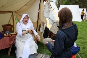 re-enactor with animal fur coats