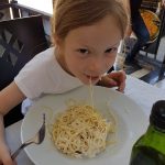 Girl eating carbonara in the Orient Express