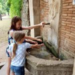 kids at the font by the monastery