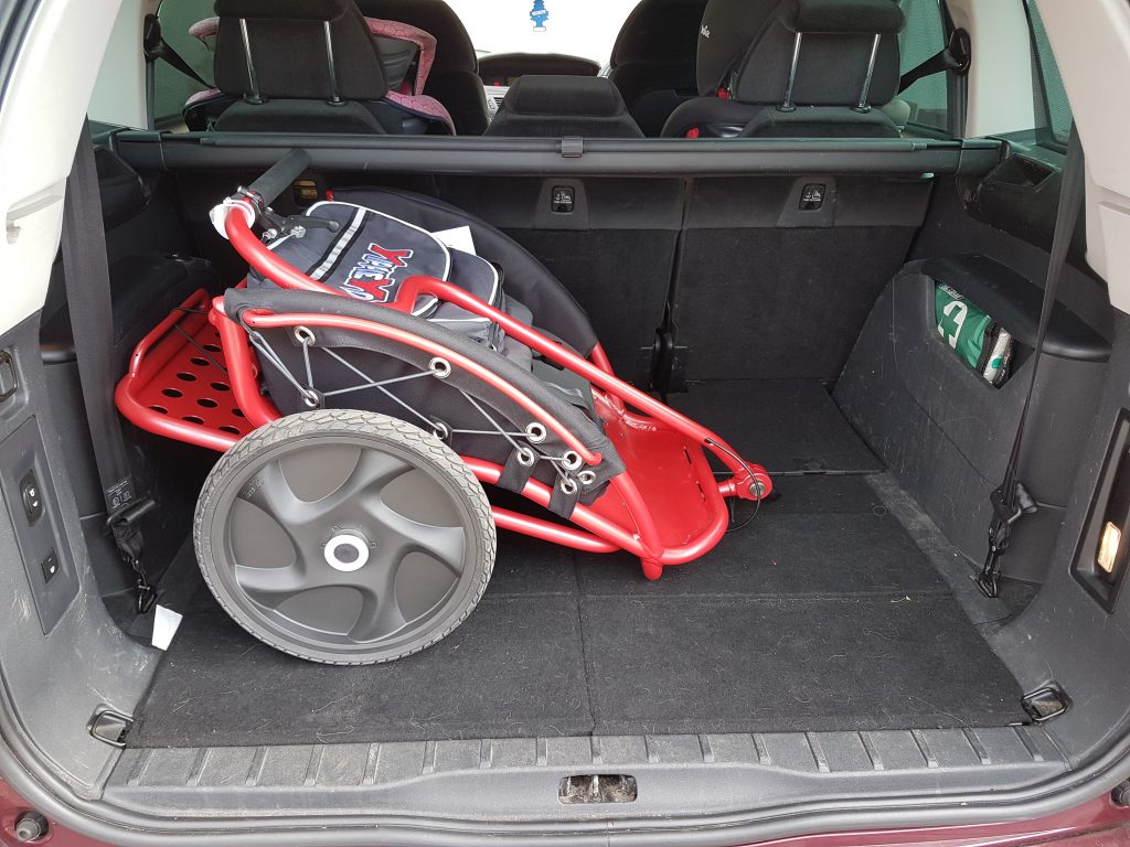 yippie yo cross buggy in the boot of the car with wheels on