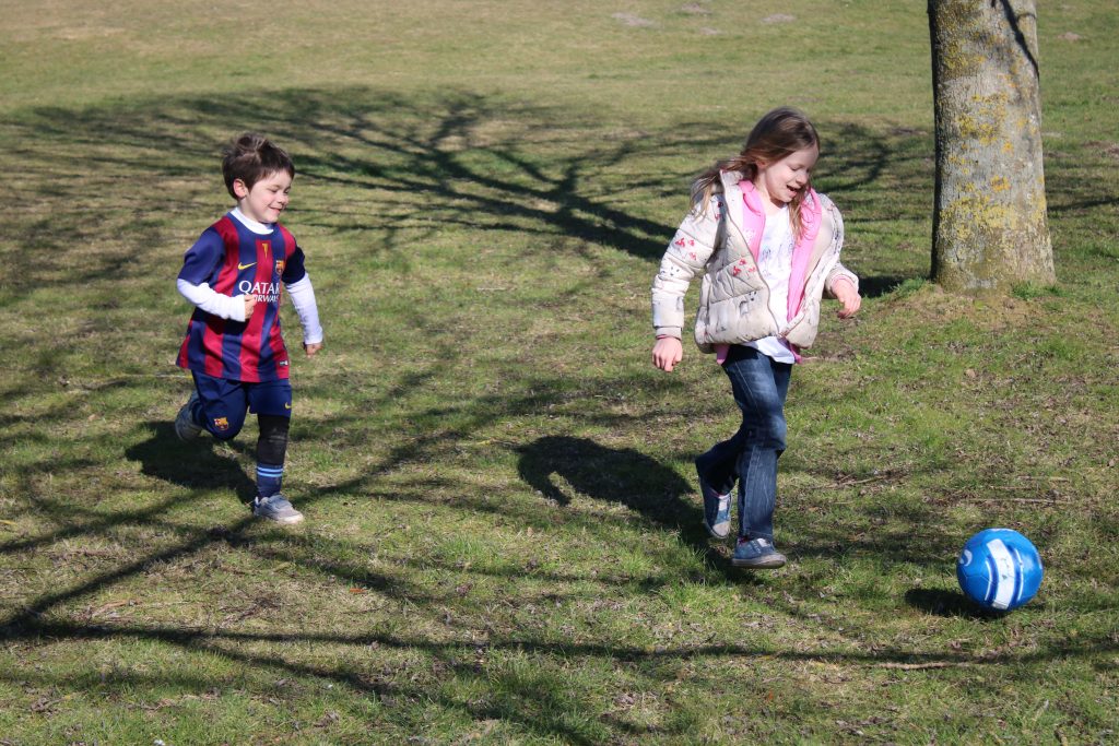 Lois and Cody playing football