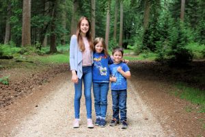 kids standing together on path in the new forest