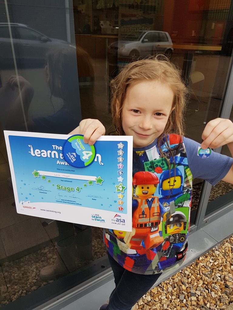 Lois with swim certificate