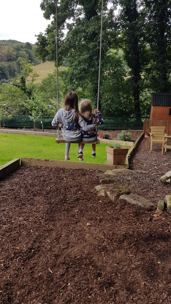 girls on the tree rope swing at our Air BnB