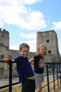 Kids stood on the fence outside Oxford castle and prison