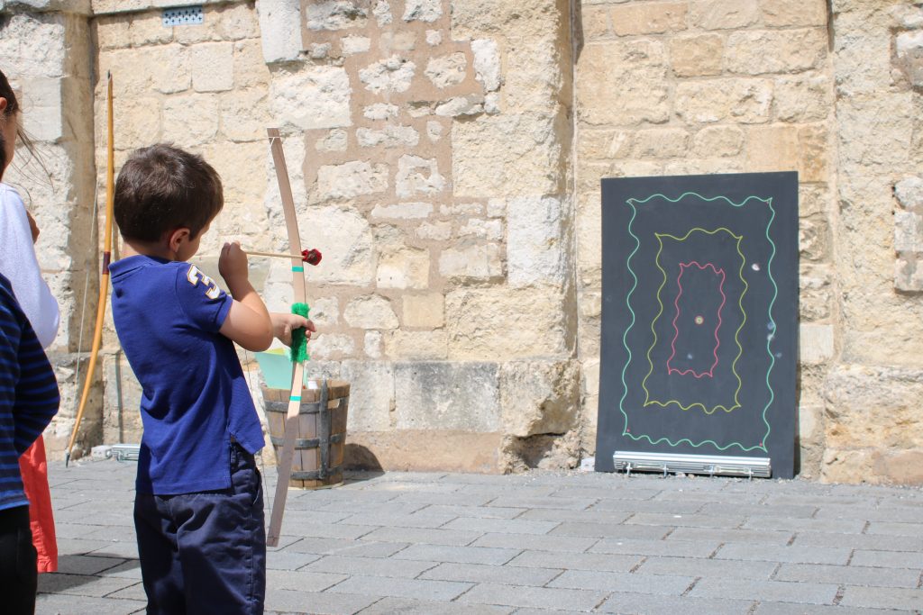 Boy trying out archery
