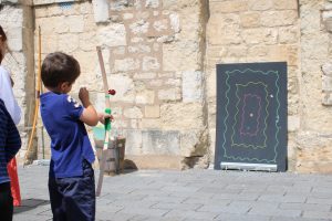 Boy trying out archery