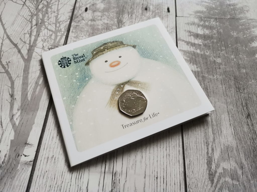 The Snowman collectors coin in cardboard sleeve