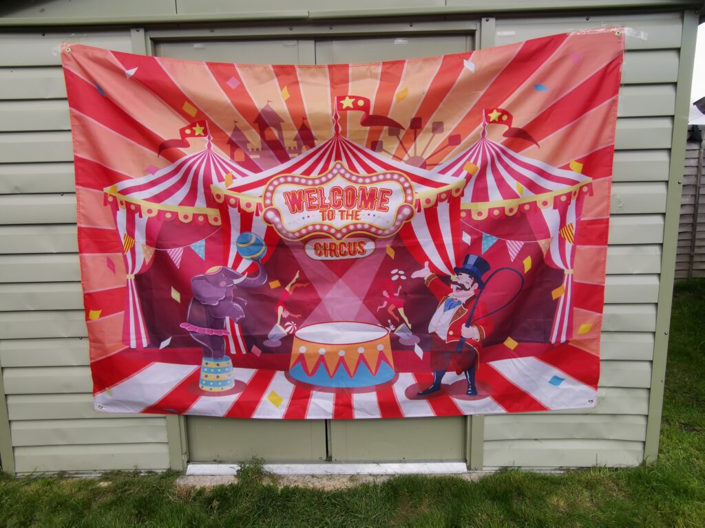 circus banner hanging on shed