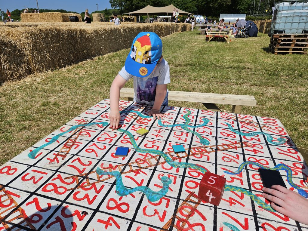 giant wooden snakes and ladders game