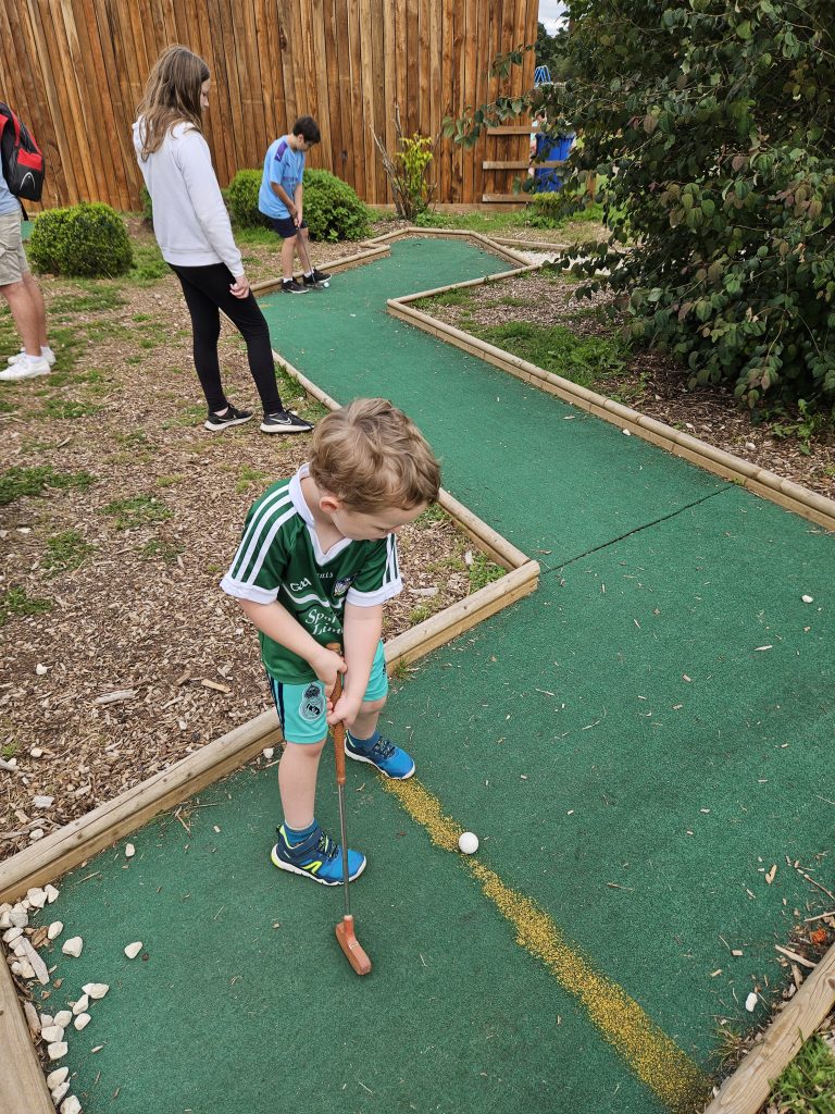 Children playing miniature golf