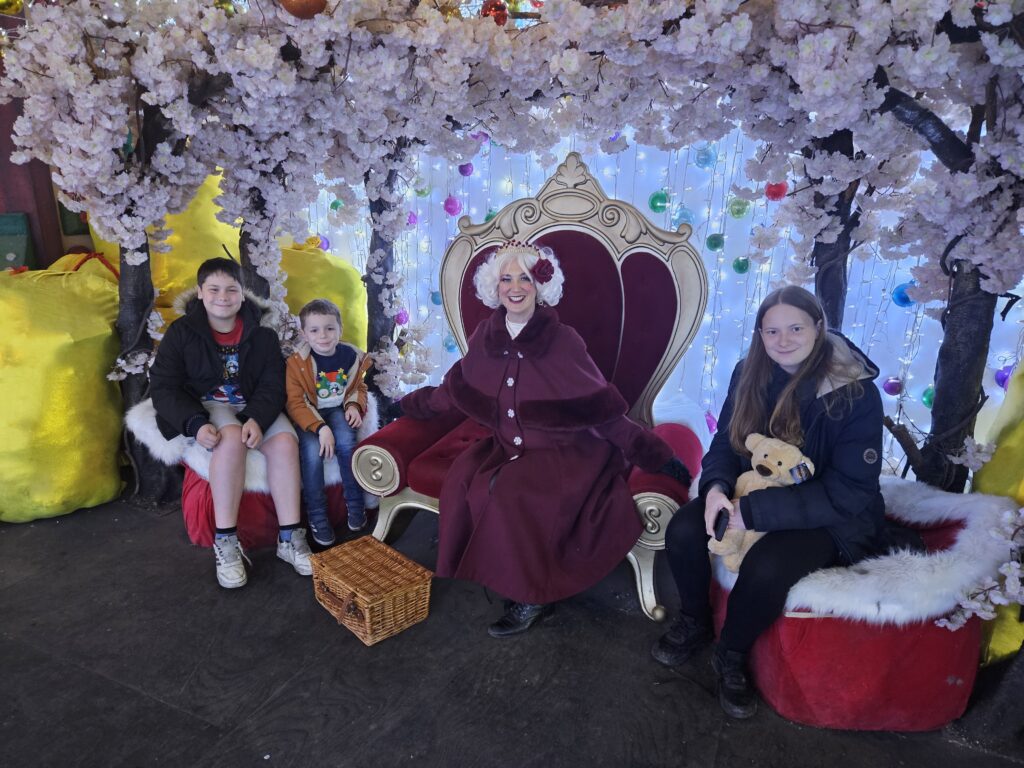 Mrs Claus sat with 3 children